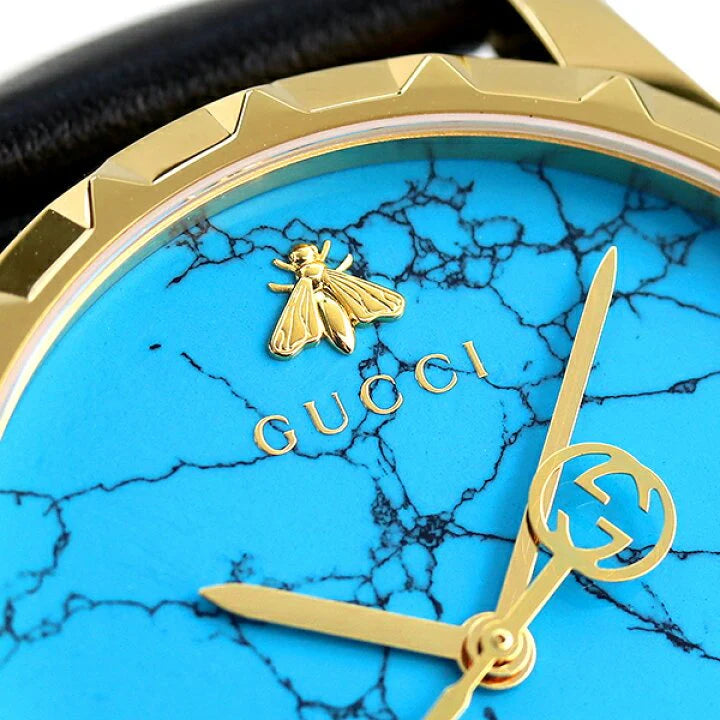 Gucci G Timeless Herrenuhr mit türkisblauem Zifferblatt und schwarzem Lederarmband - YA126462